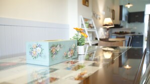 A kitchen with a countertop, a floral box, and a potted plant. - Blue Cotton Candy (Taitung)