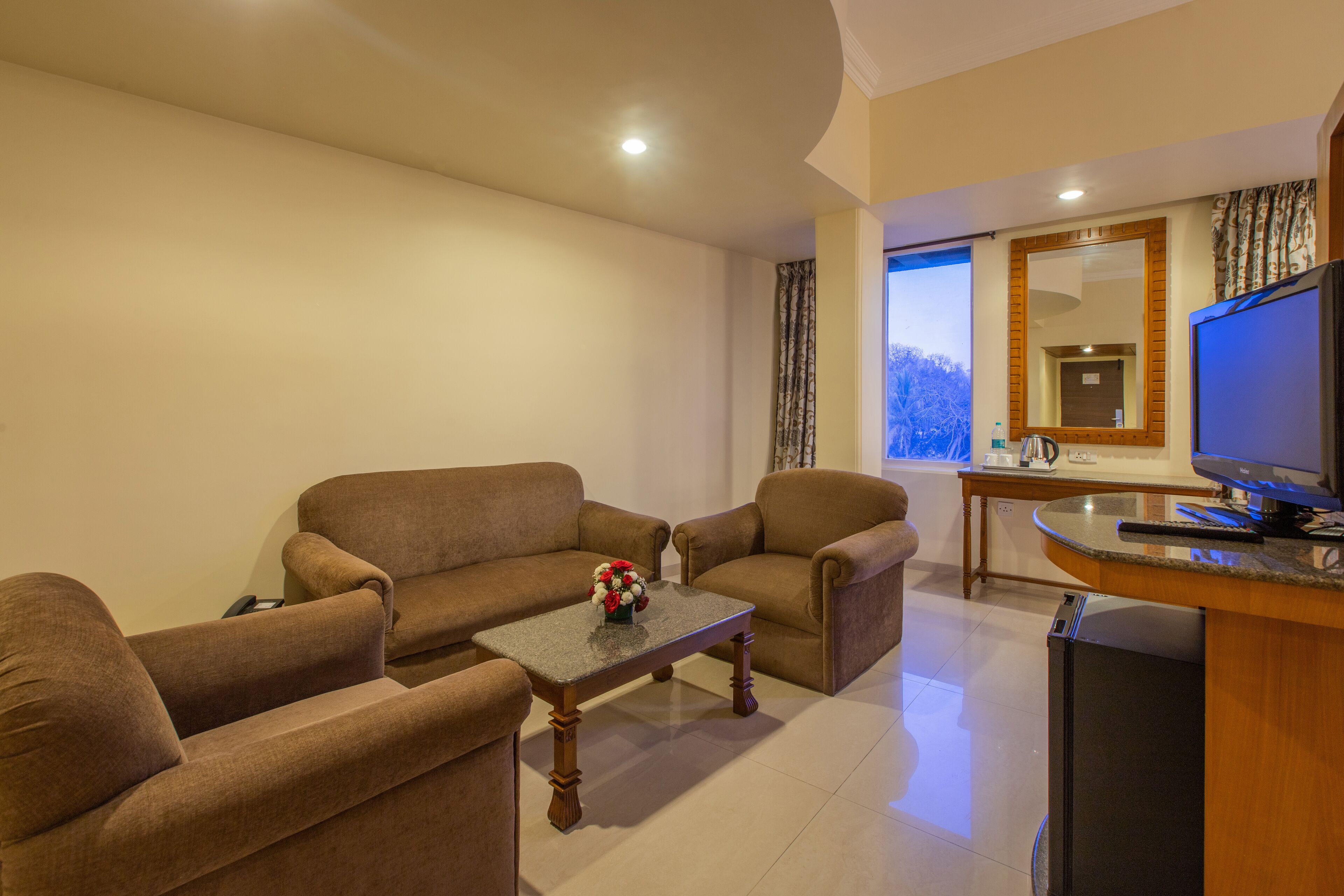 suite | living area | 42-inch led tv with satellite channels, tv, fireplace
