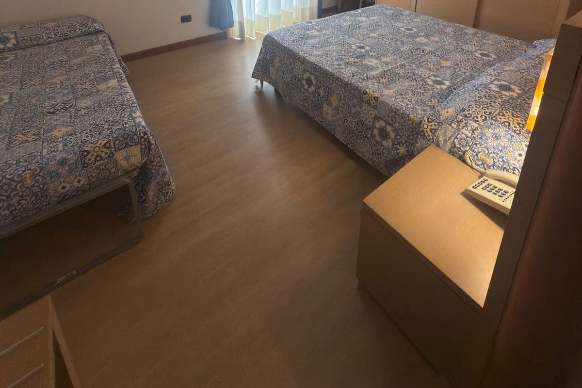 Deluxe Triple Room | Desk, laptop workspace, WiFi (free), bed sheets