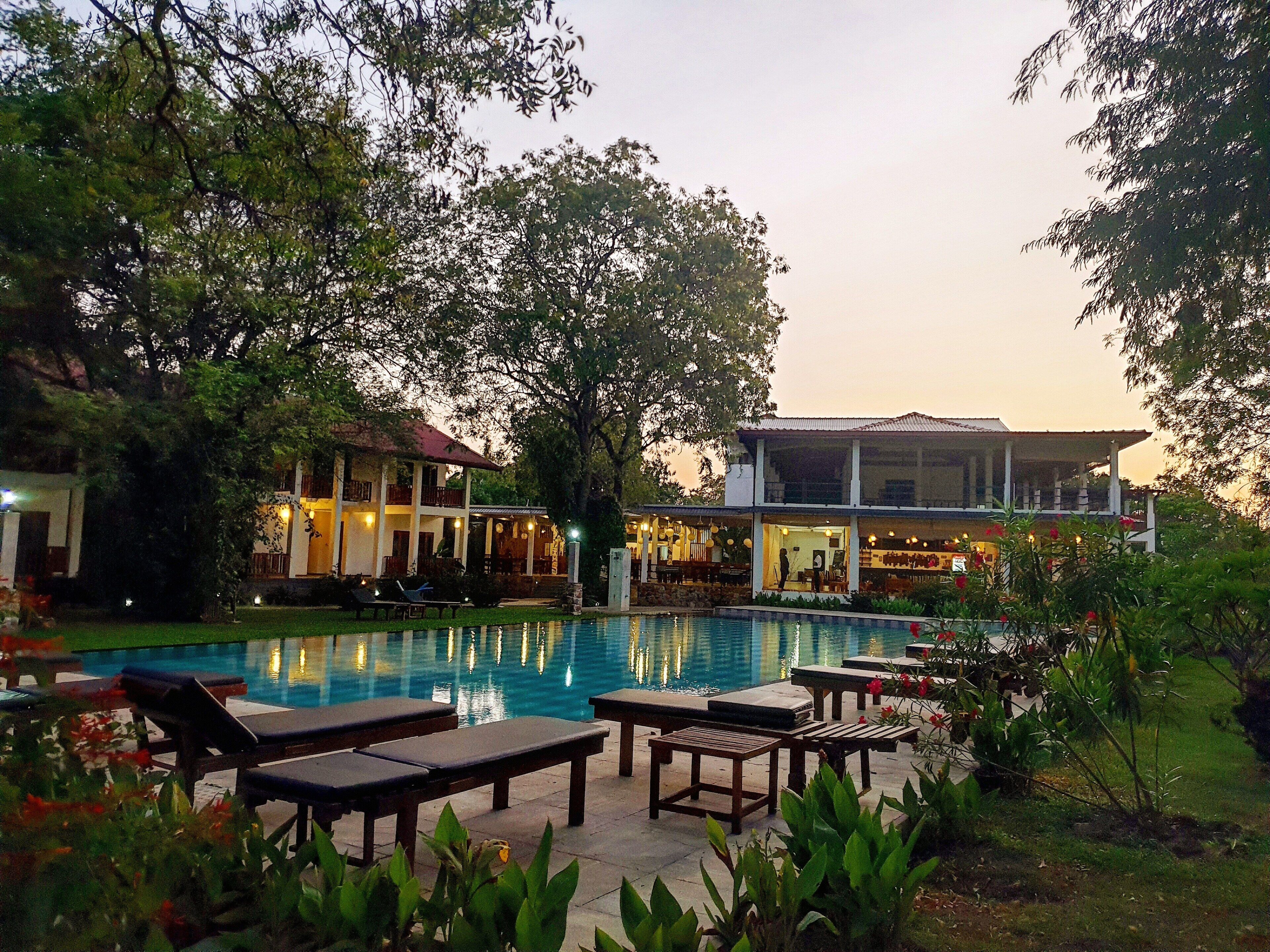 outdoor pool, open 7:30 am to 8:30 pm, pool loungers