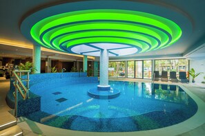 Relax by the pool surrounded by a circular design and comfortable seating.