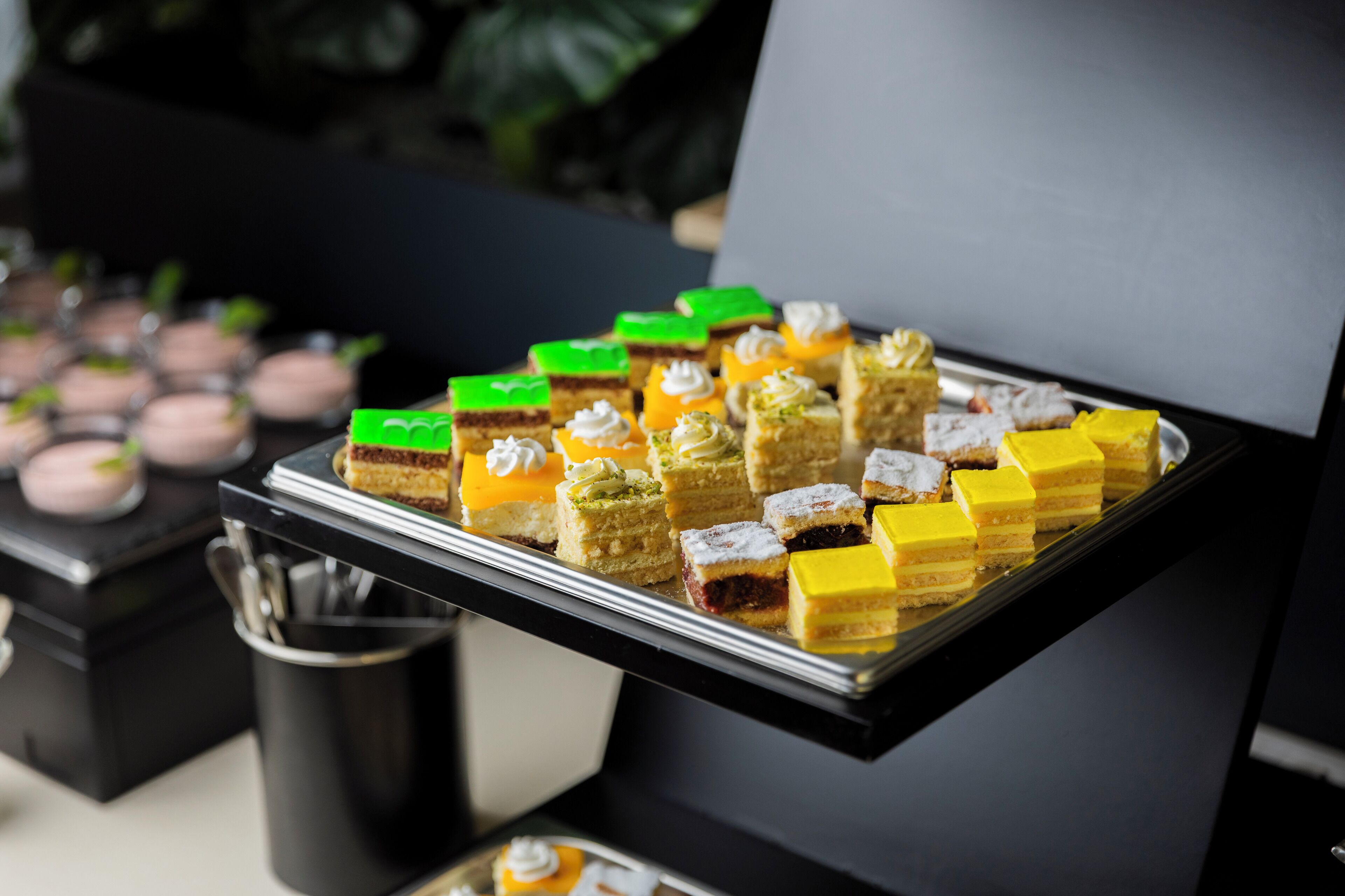 A tray of assorted desserts on a table.