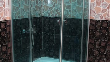 Deluxe Room (with AC) | Bathroom shower