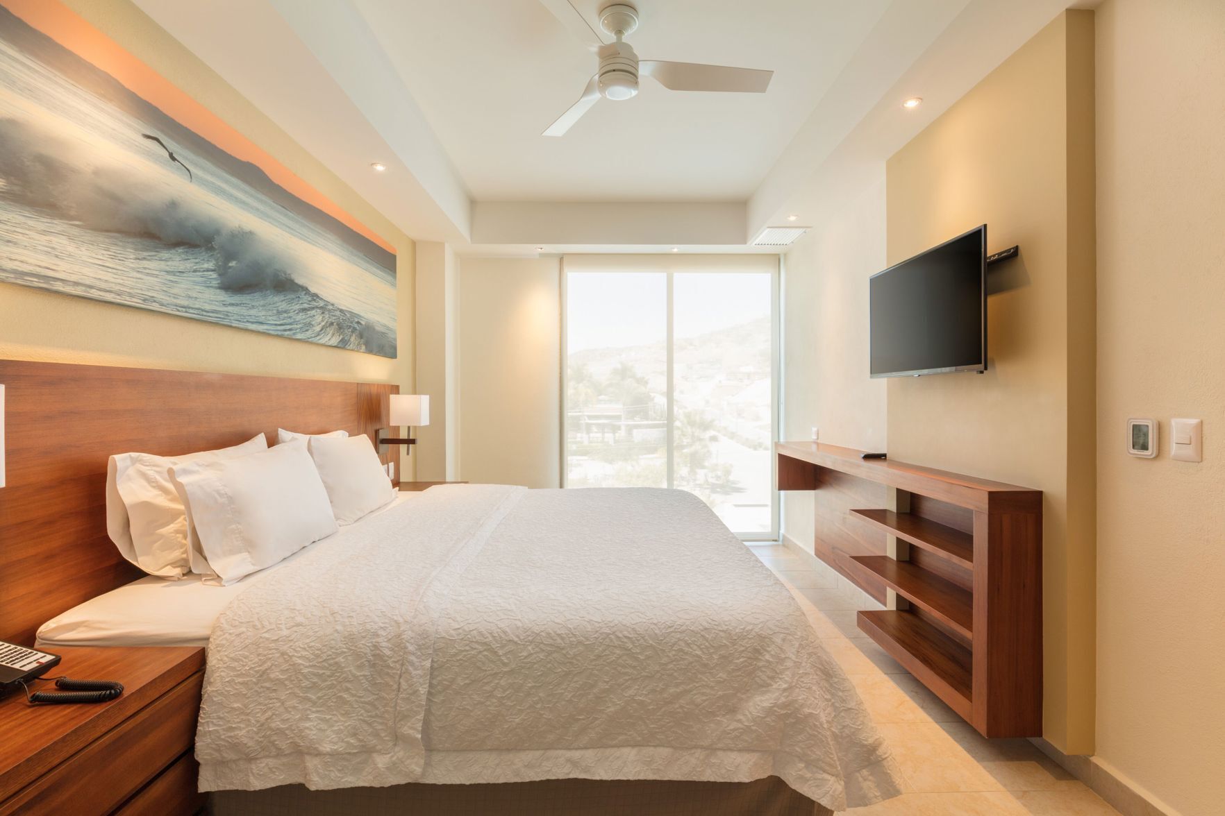 Premium bedding, down comforters, pillowtop beds, in-room safe