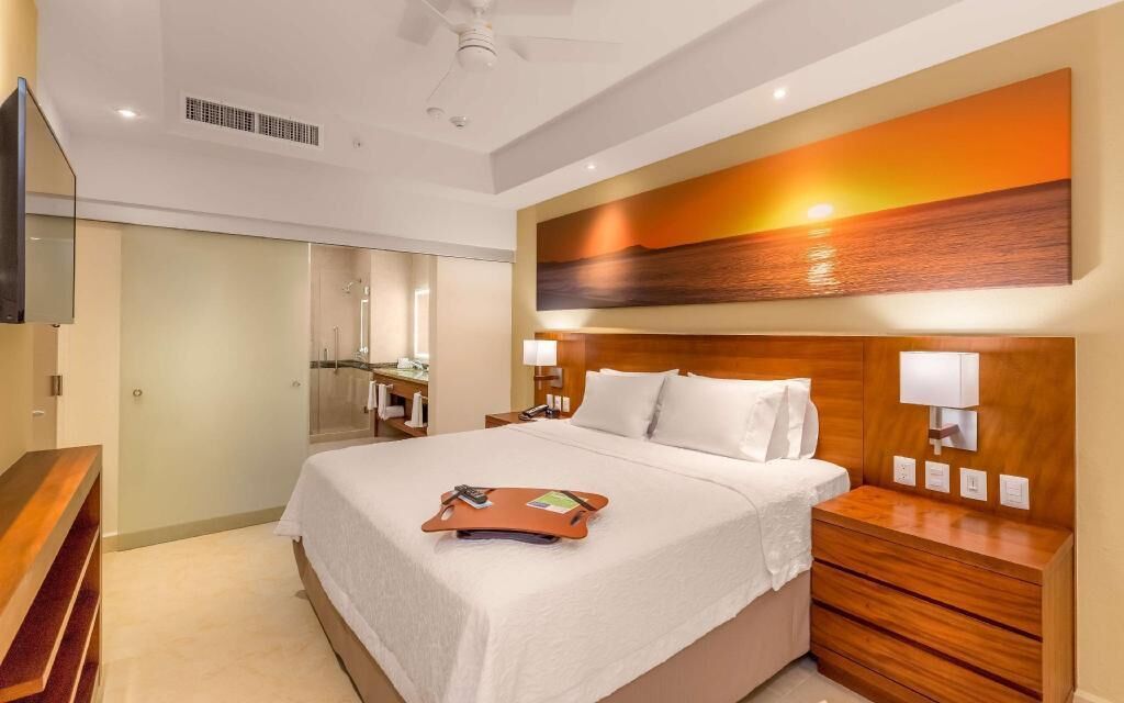 Premium bedding, down comforters, pillowtop beds, in-room safe