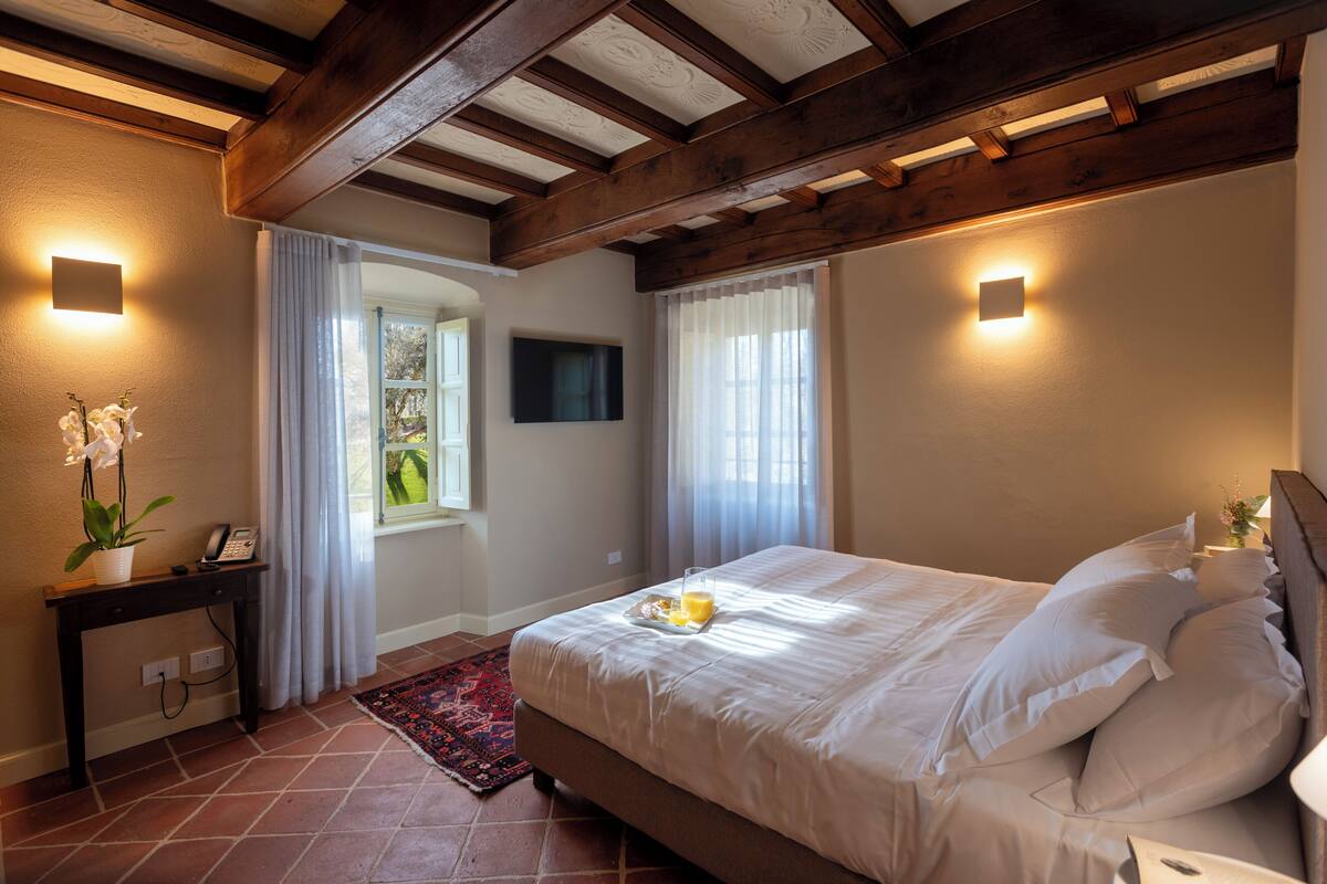 Suite superior | Ropa de cama de alta calidad, edredón y minibar