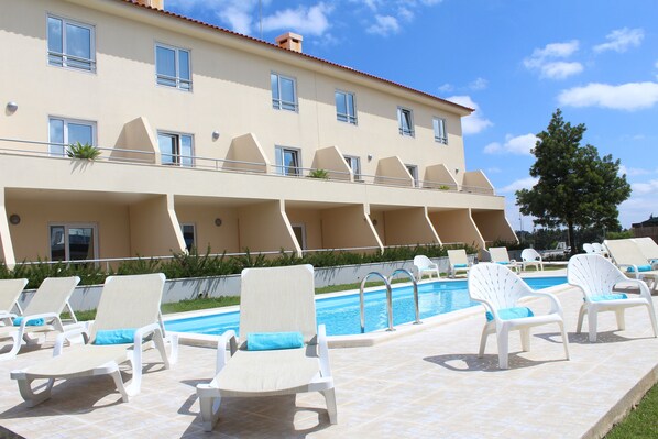 Seasonal outdoor pool, pool loungers