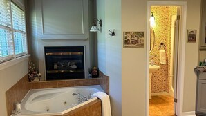 Un baño moderno con una bañera independiente, chimenea y zona de ducha.