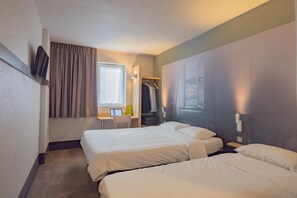 A hotel room with two beds, a desk, a chair, a coat rack, and a television mounted on the wall. - B&B HOTEL Angers 2 Université (Beaucouze)