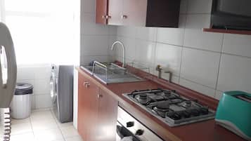 Departamento, 2 habitaciones | 1 habitación, edredón y caja de seguridad en la habitación