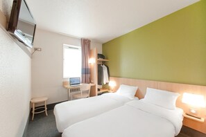 A hotel room with two beds, a desk with a computer, a chair, a wardrobe, and a window with curtains. - Kyriad Direct Clermont Ferrand Nord - Gerzat (Gerzat)
