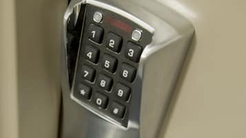 A numeric keypad lock on a door.