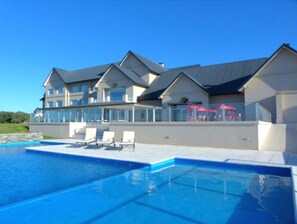 Indoor pool, outdoor pool, open noon to 8 PM, pool loungers