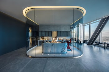 A modern high-rise building with illuminated windows and a prominent corner location. at InterContinental Los Angeles Downtown by IHG