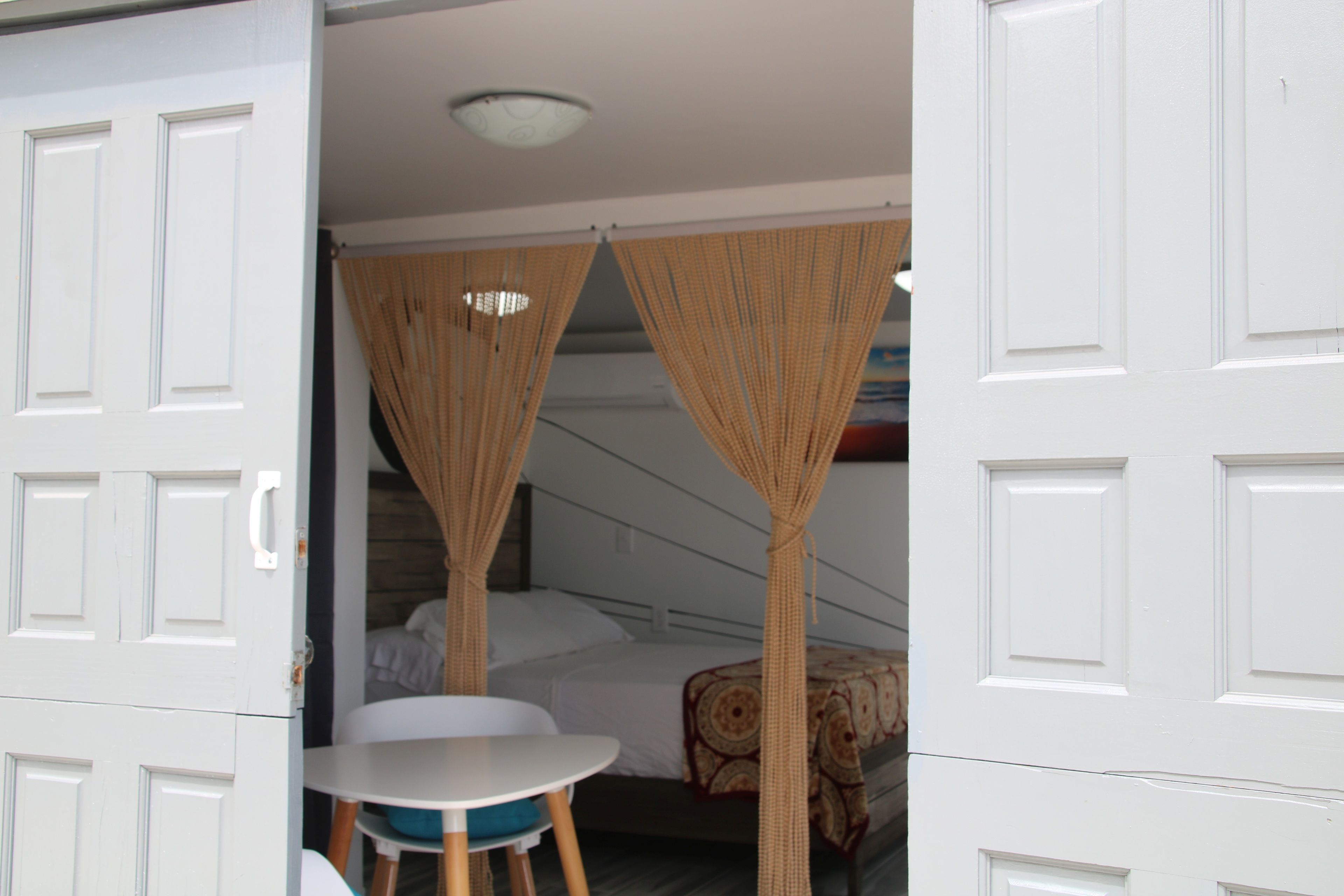 comfort double room, sea view from in and outside the room, ground floor | in-room safe, bed sheets