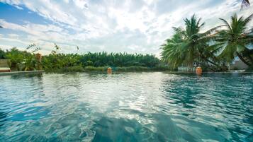 Outdoor pool, an infinity pool, sun loungers