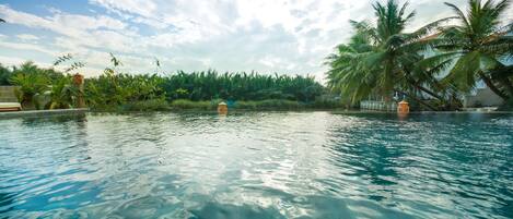 Outdoor pool, an infinity pool, sun loungers