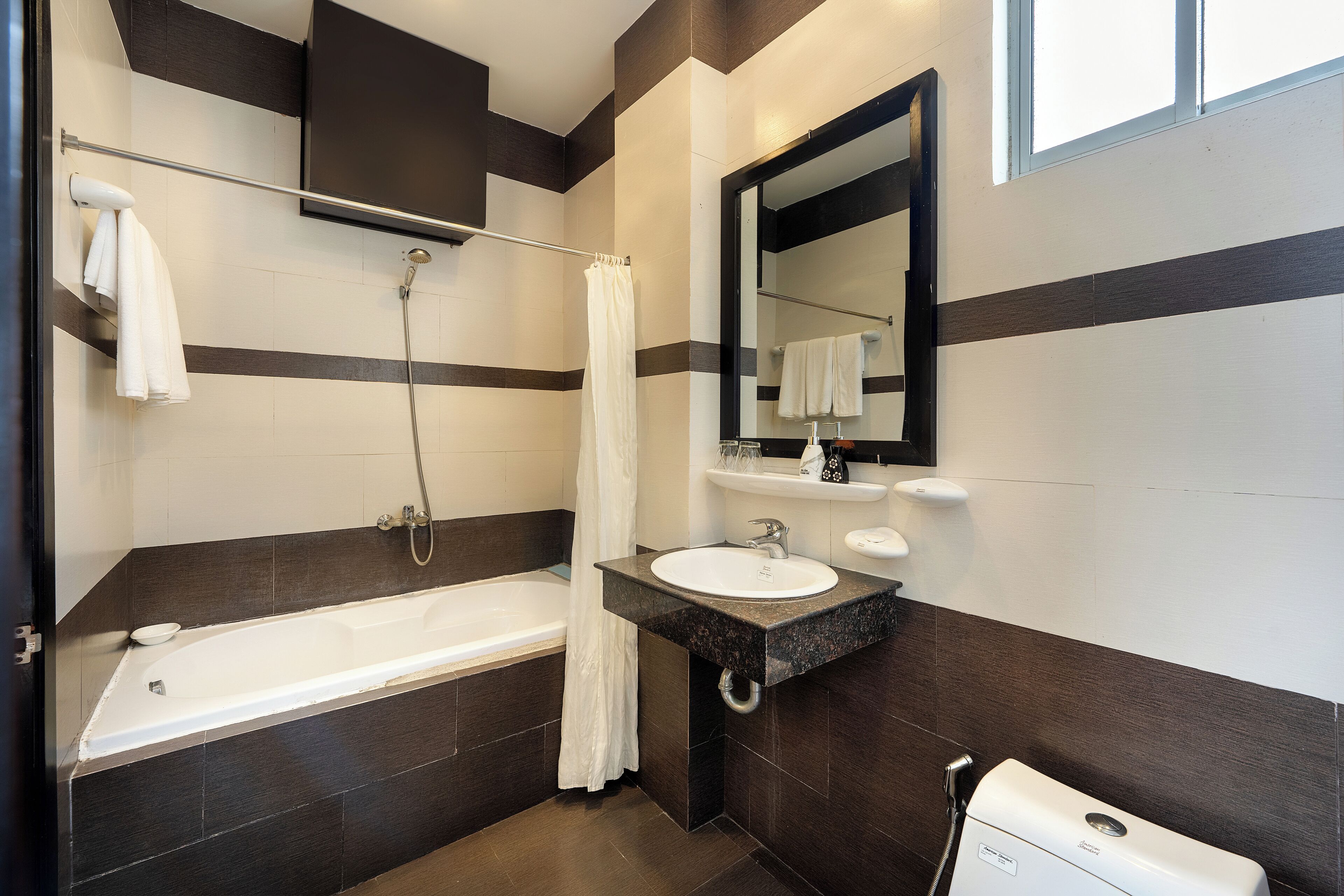 deluxe double room | bathroom | free toiletries, hair dryer, slippers, towels