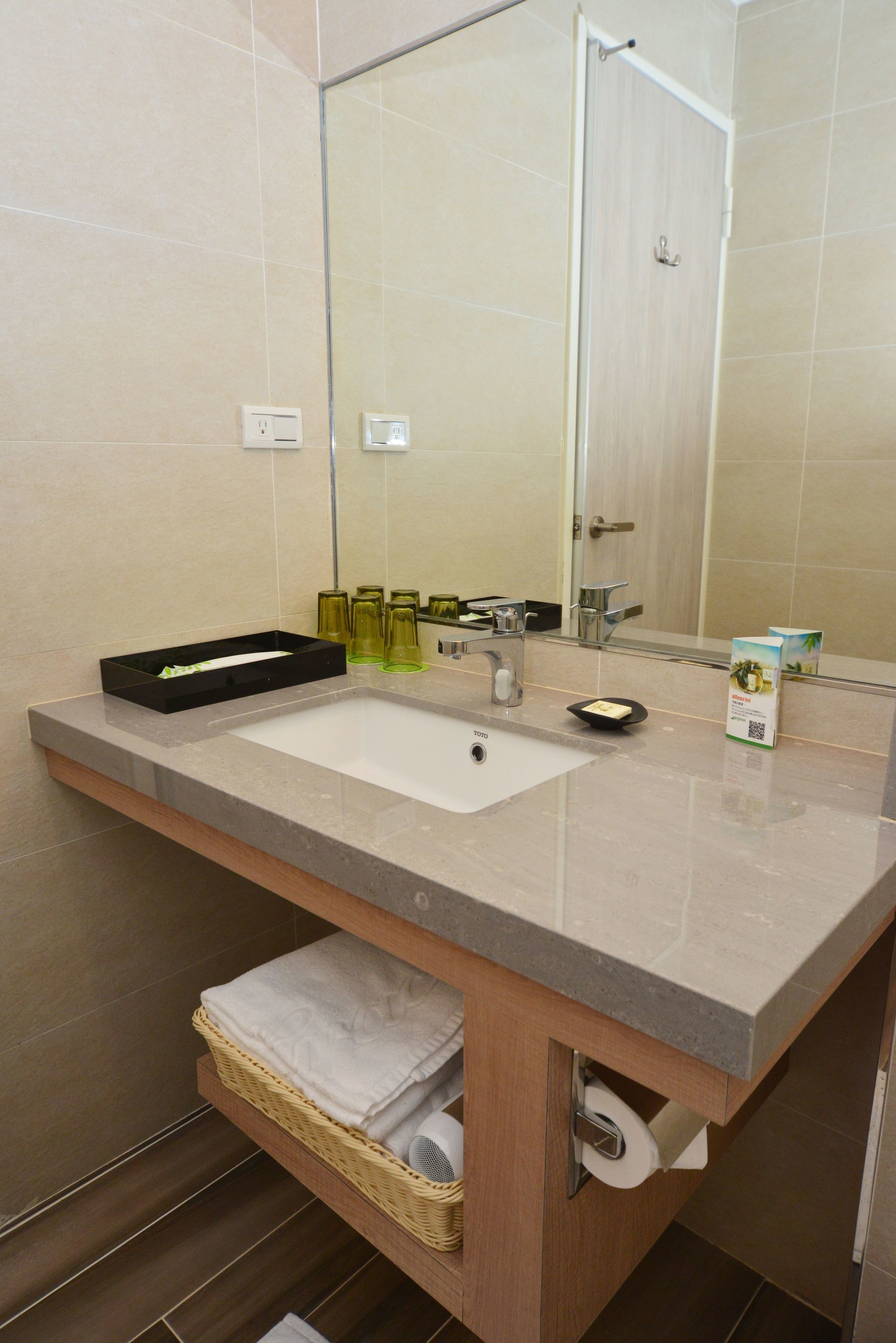 rainfall showerhead, hair dryer, slippers, towels