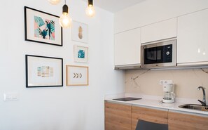 Junior Suite Deluxe | Cozinha privada | Geladeira, micro-ondas (mediante solicitação), cooktop