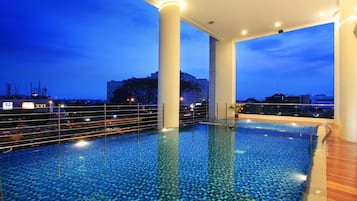 Outdoor pool, open 6:00 AM to 6:00 PM, pool loungers