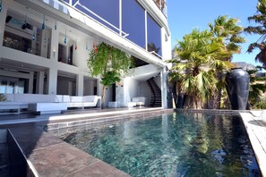 Outdoor pool, pool umbrellas, pool loungers