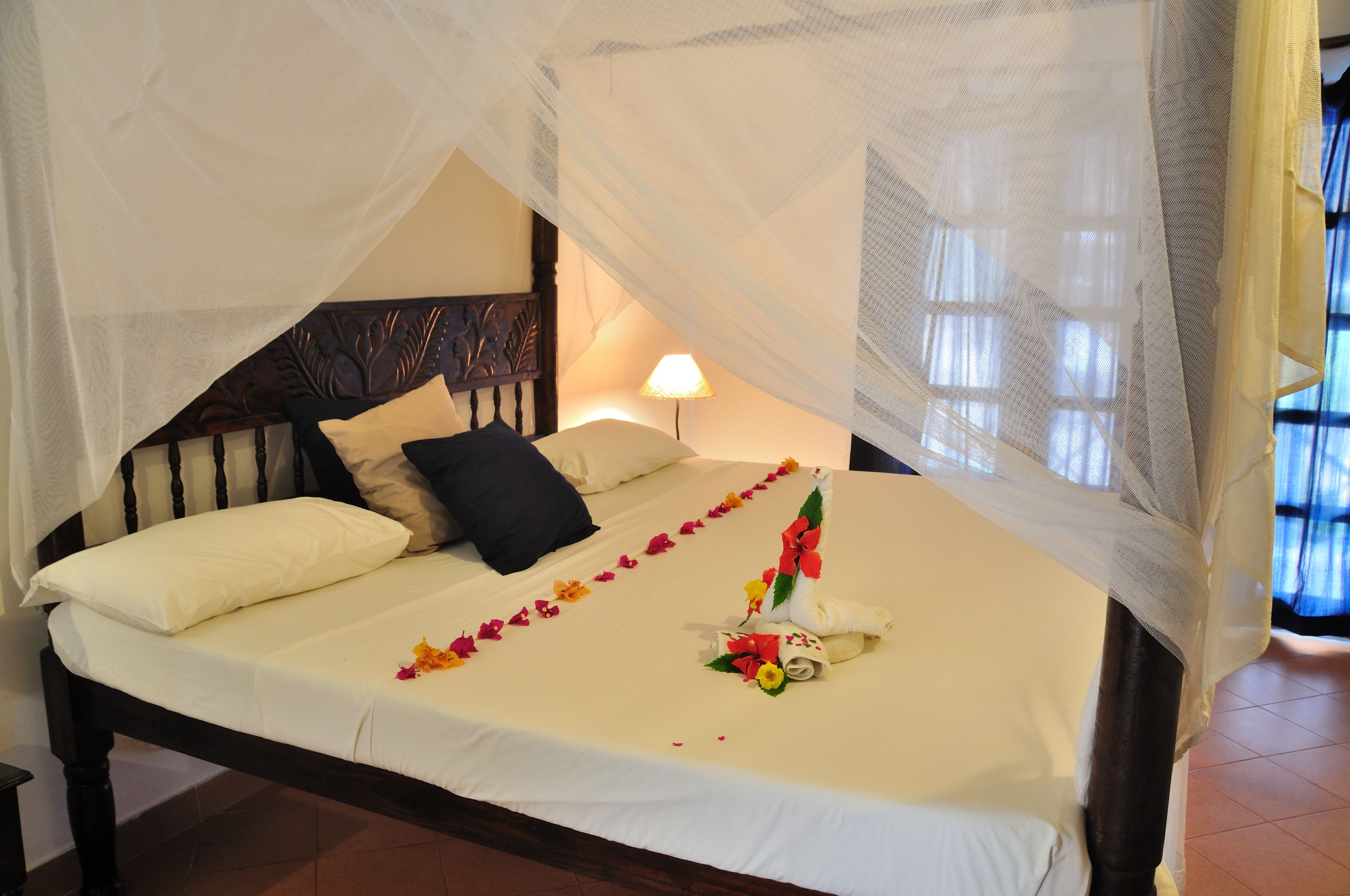 Standard Triple Room, Garden View | Desk, blackout drapes, bed sheets