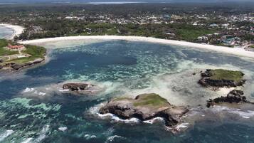 Private beach, white sand, sun loungers, beach umbrellas