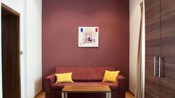 Deluxe Apartment, 1 Bedroom | Living area | Flat-screen TV