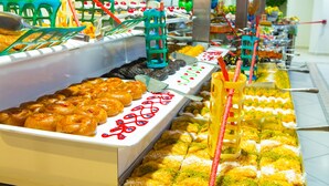 A buffet with various food items and serving utensils. - Gardenia Beach Hotel - All Inclusive (Alanya)