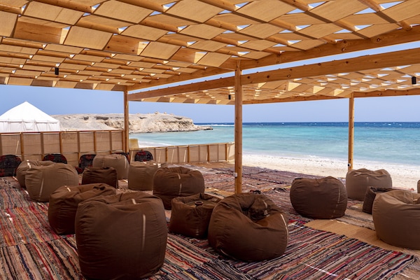 On the beach, sun-loungers, beach umbrellas, beach towels