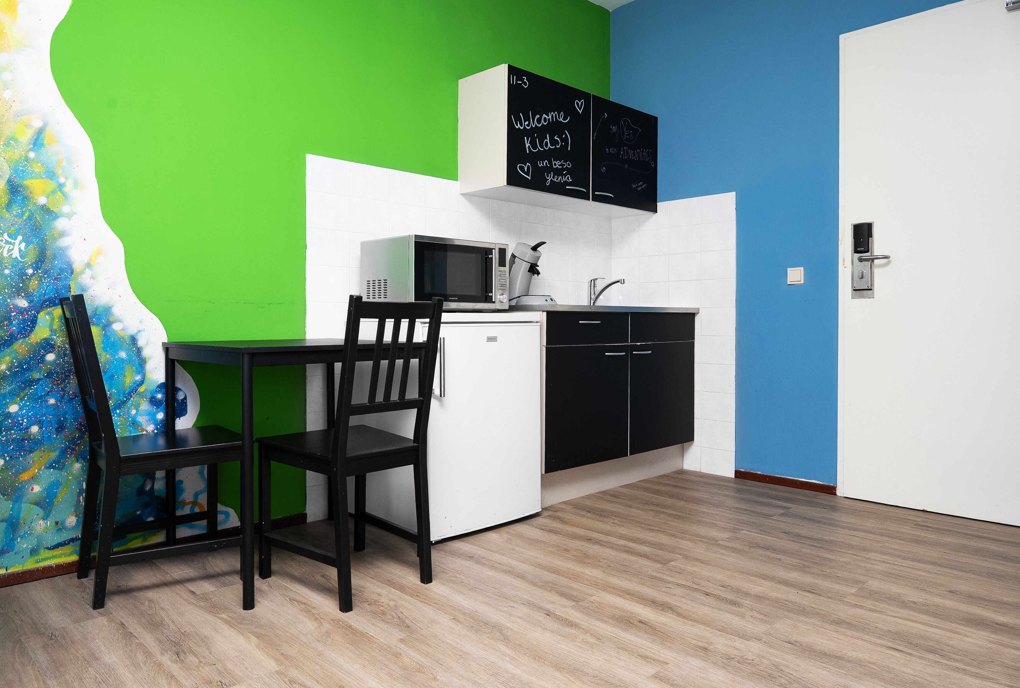 economy room, multiple beds | private kitchenette