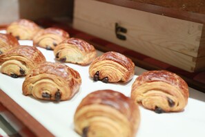 A display of croissants on a tray.