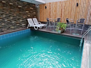 Outdoor pool, open 8:00 AM to 8:30 PM, pool loungers