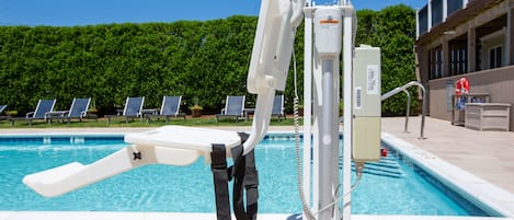 Seasonal outdoor pool, pool loungers