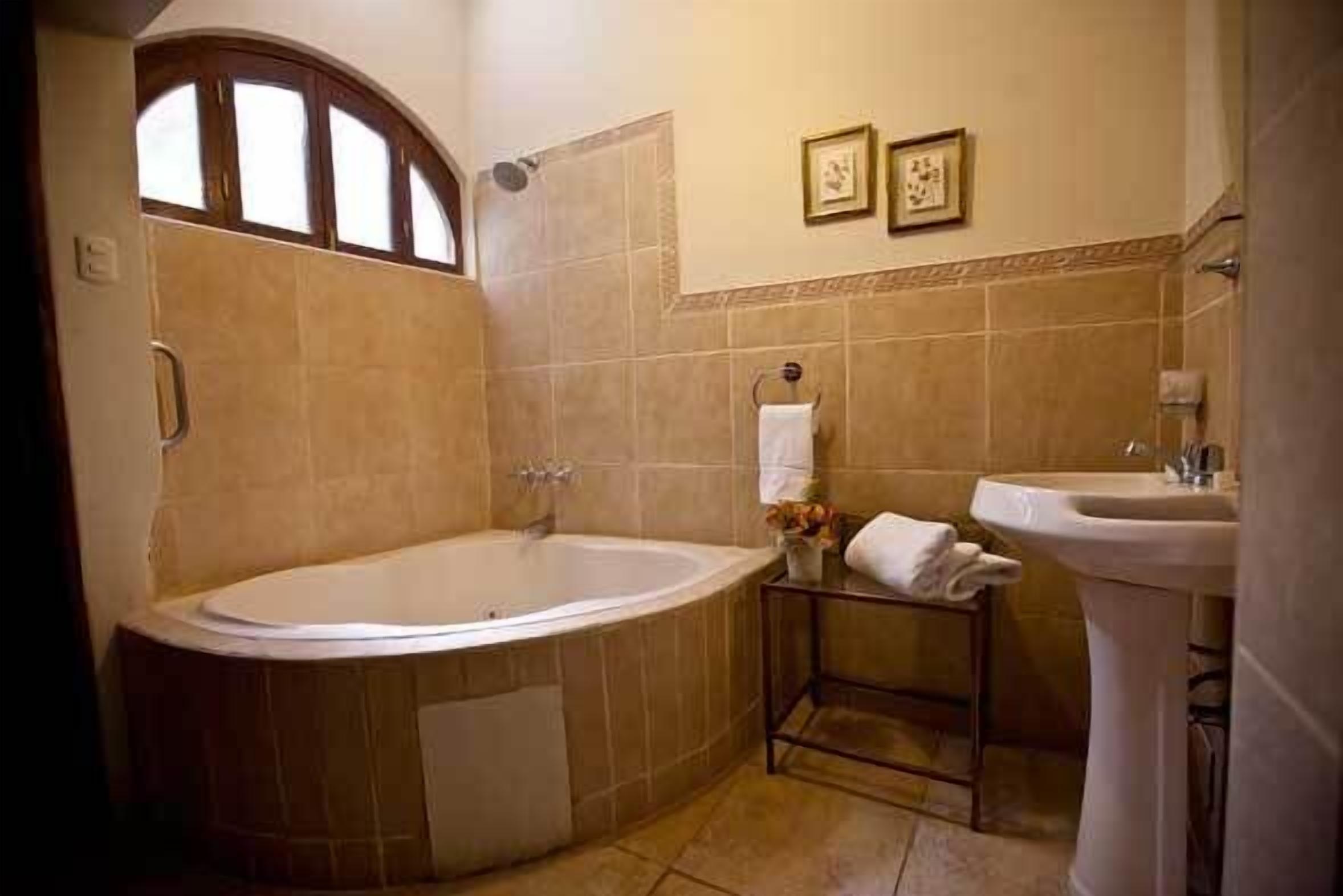 suite, jetted tub | bathroom | free toiletries, towels, soap, shampoo