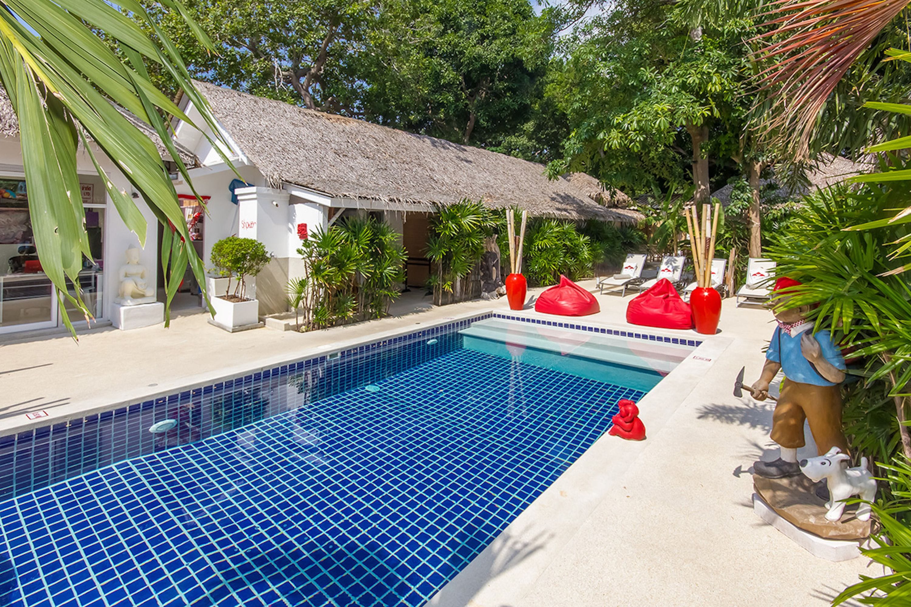 outdoor pool, pool umbrellas, pool loungers