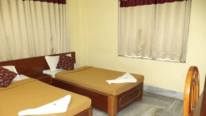 A hotel room with two single beds, wooden headboards, and a marble floor. - Simurg- AK50 New Town (Barasat)