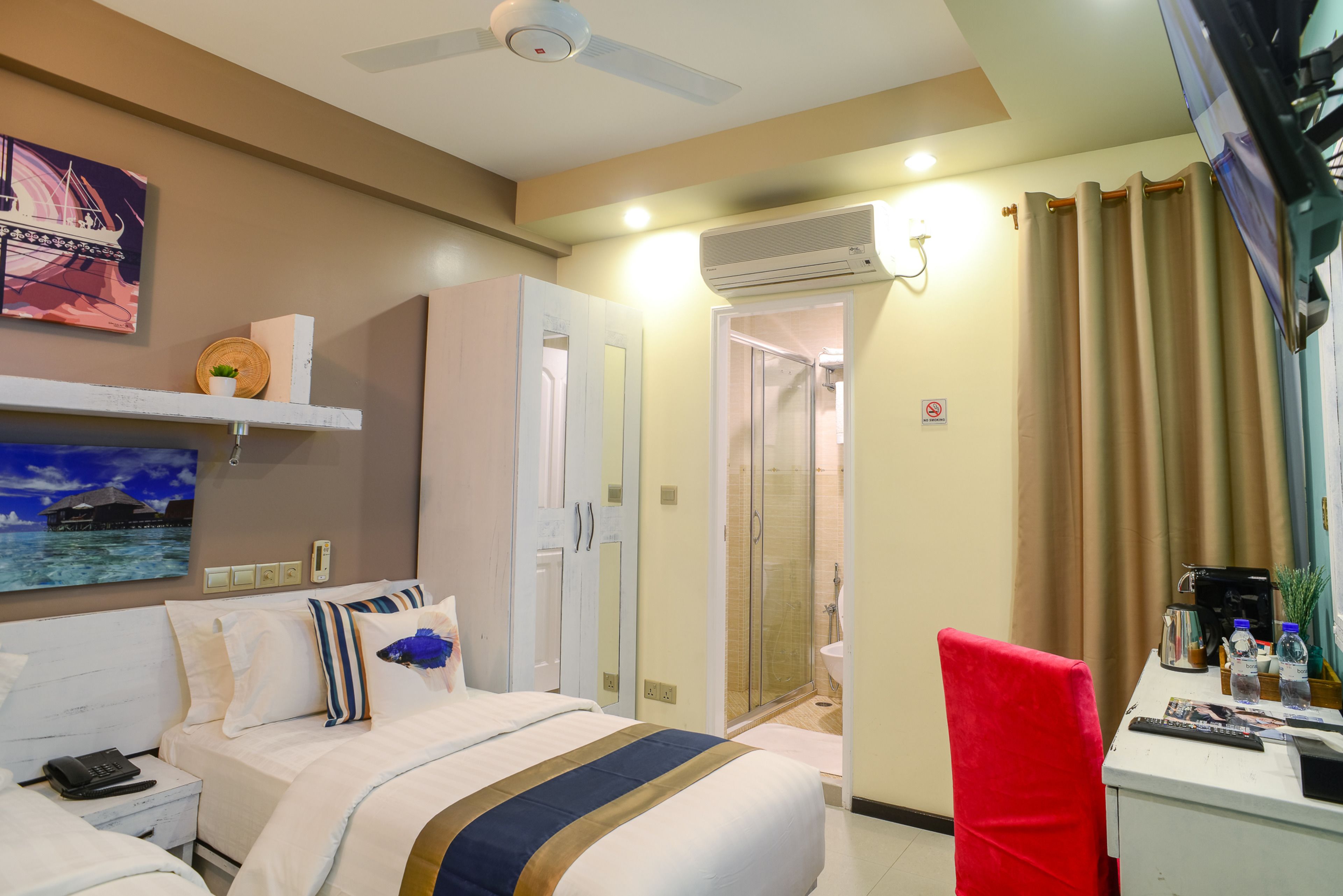 standard double or twin room with free return airport transfer | in-room safe, desk, iron/ironing board, free wifi