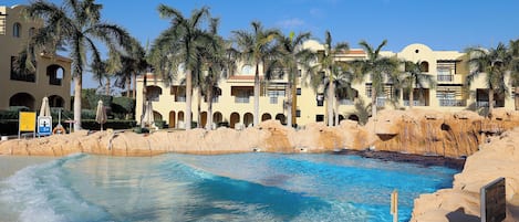 8 outdoor pools, pool umbrellas, pool loungers