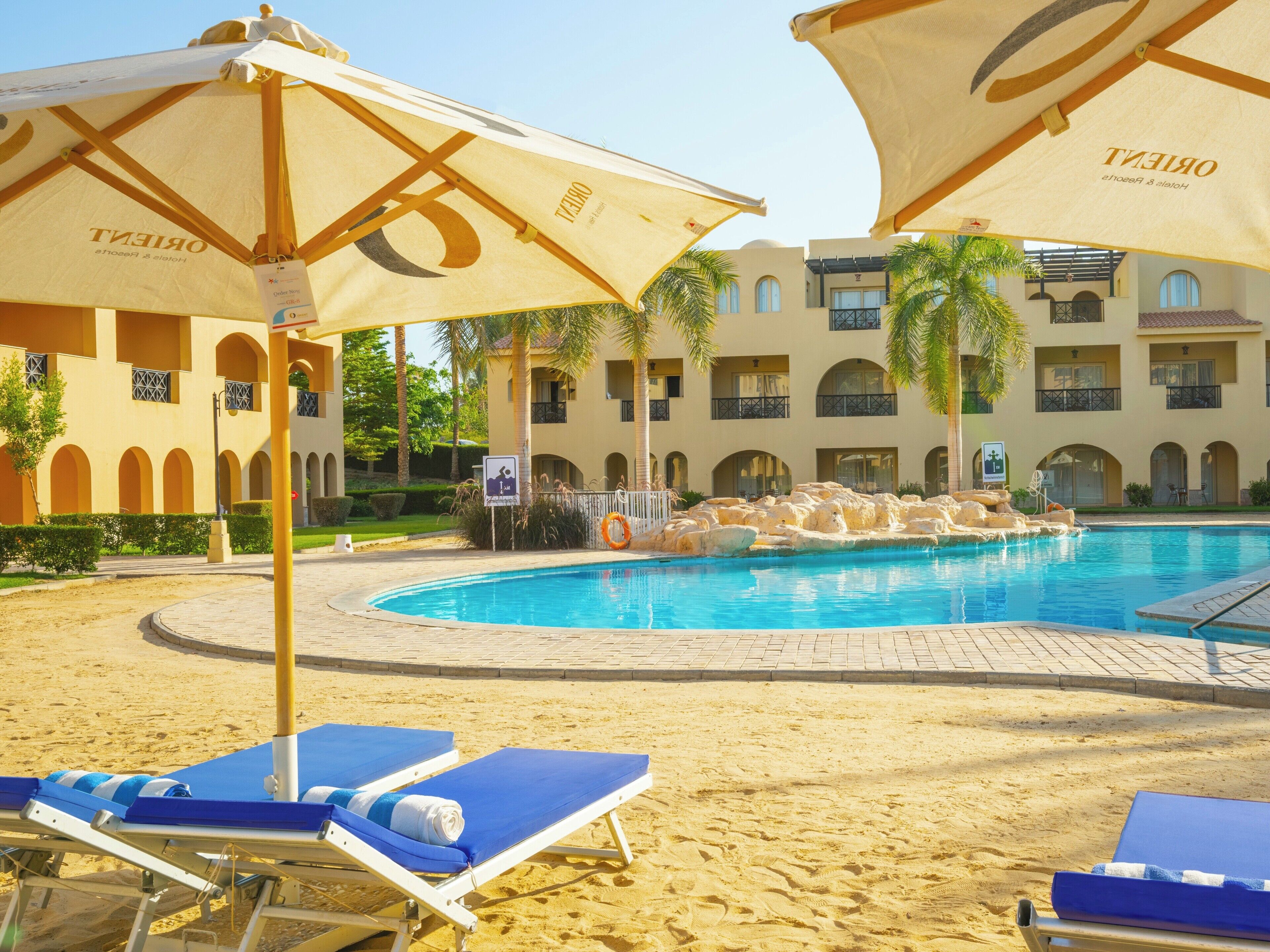 8 outdoor pools, pool umbrellas, sun loungers
