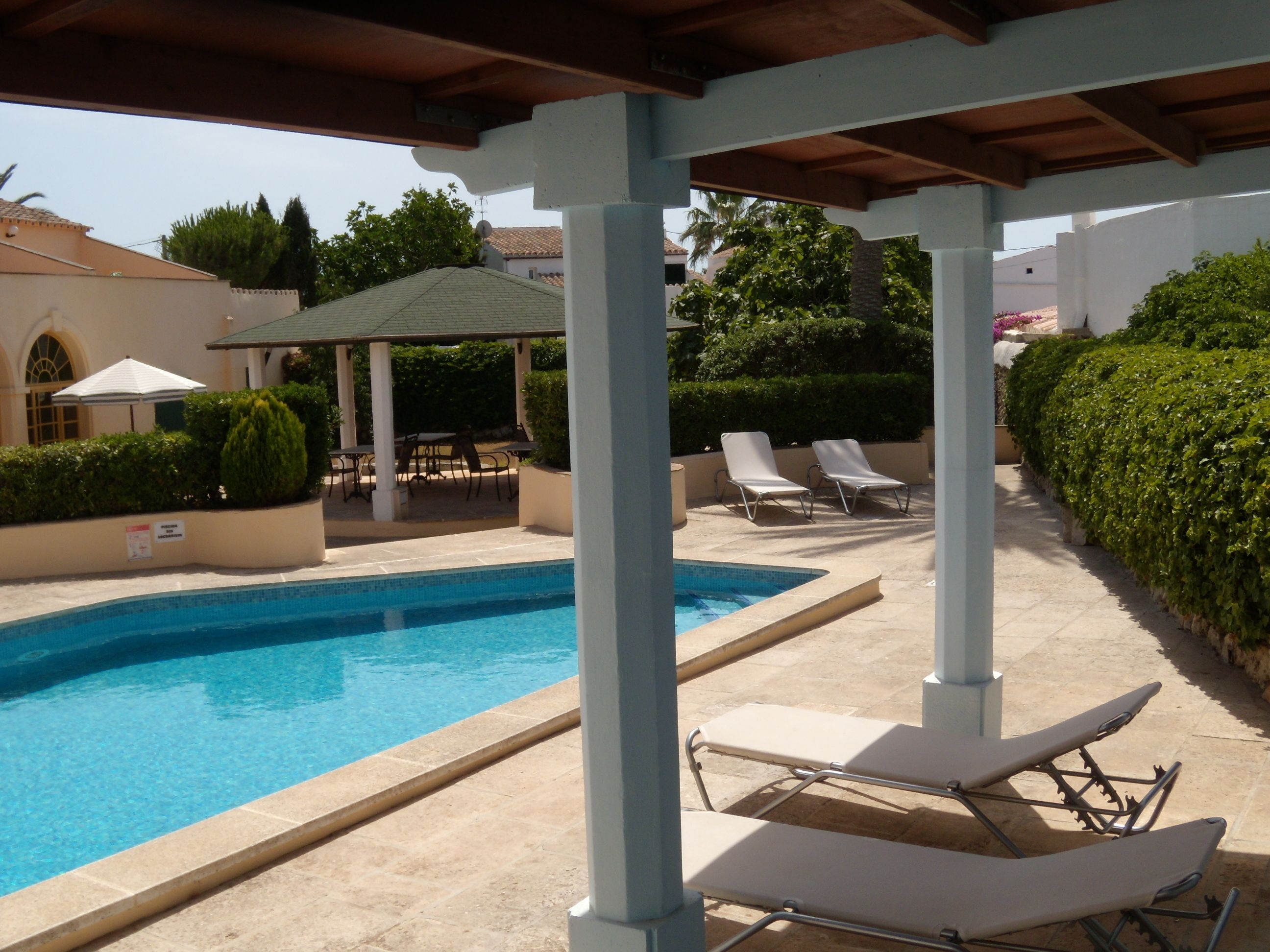 outdoor pool, pool umbrellas, pool loungers