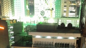 A multi-story building with balconies and a ground-level entrance. - Zerenity Hotel & Suites (Cebu City)