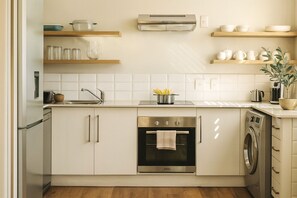 Apartment, 2 Bedrooms (Garden) | Private kitchen | Full-sized fridge, microwave, stovetop, coffee/tea maker