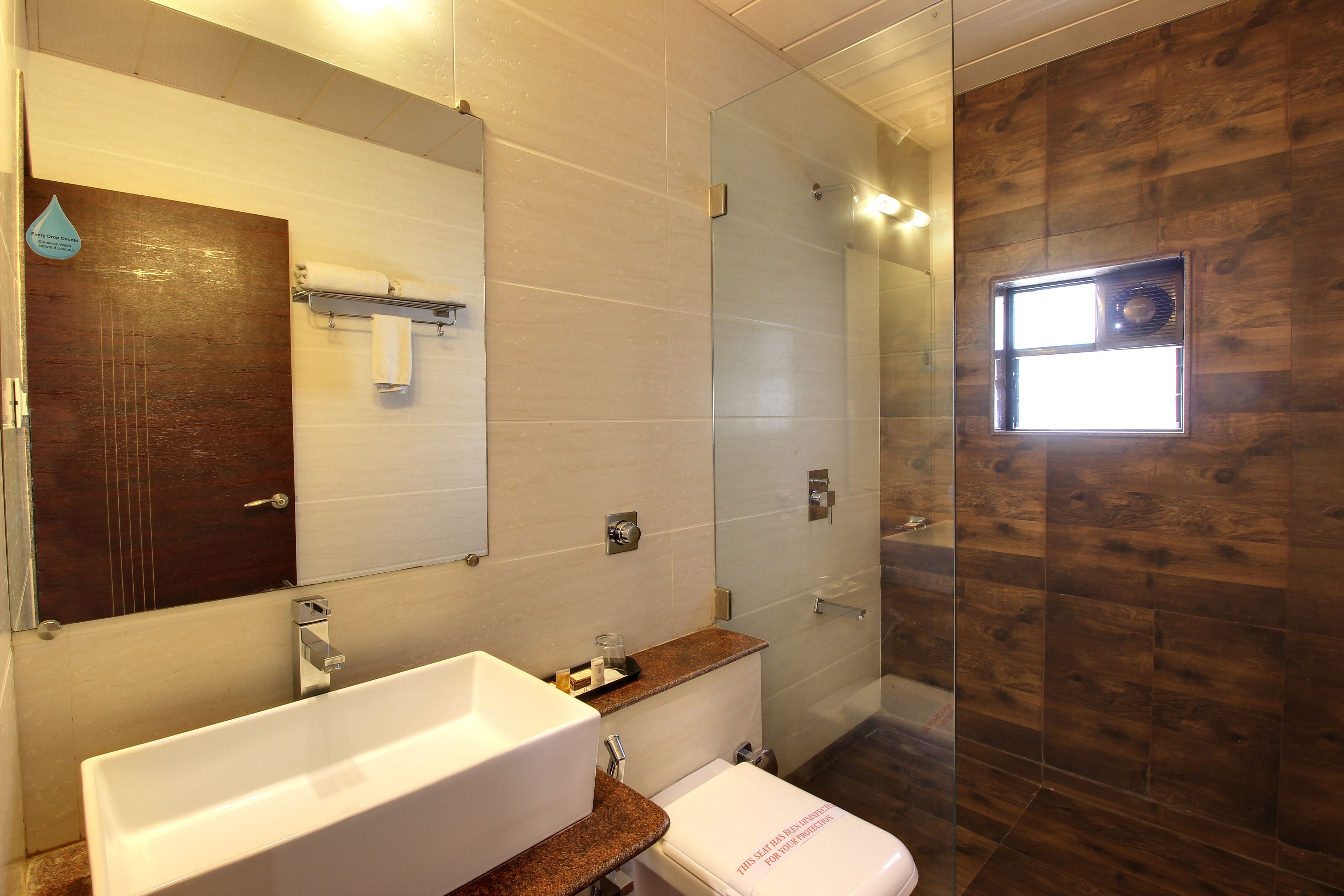 royal family room | bathroom | shower, designer toiletries, towels