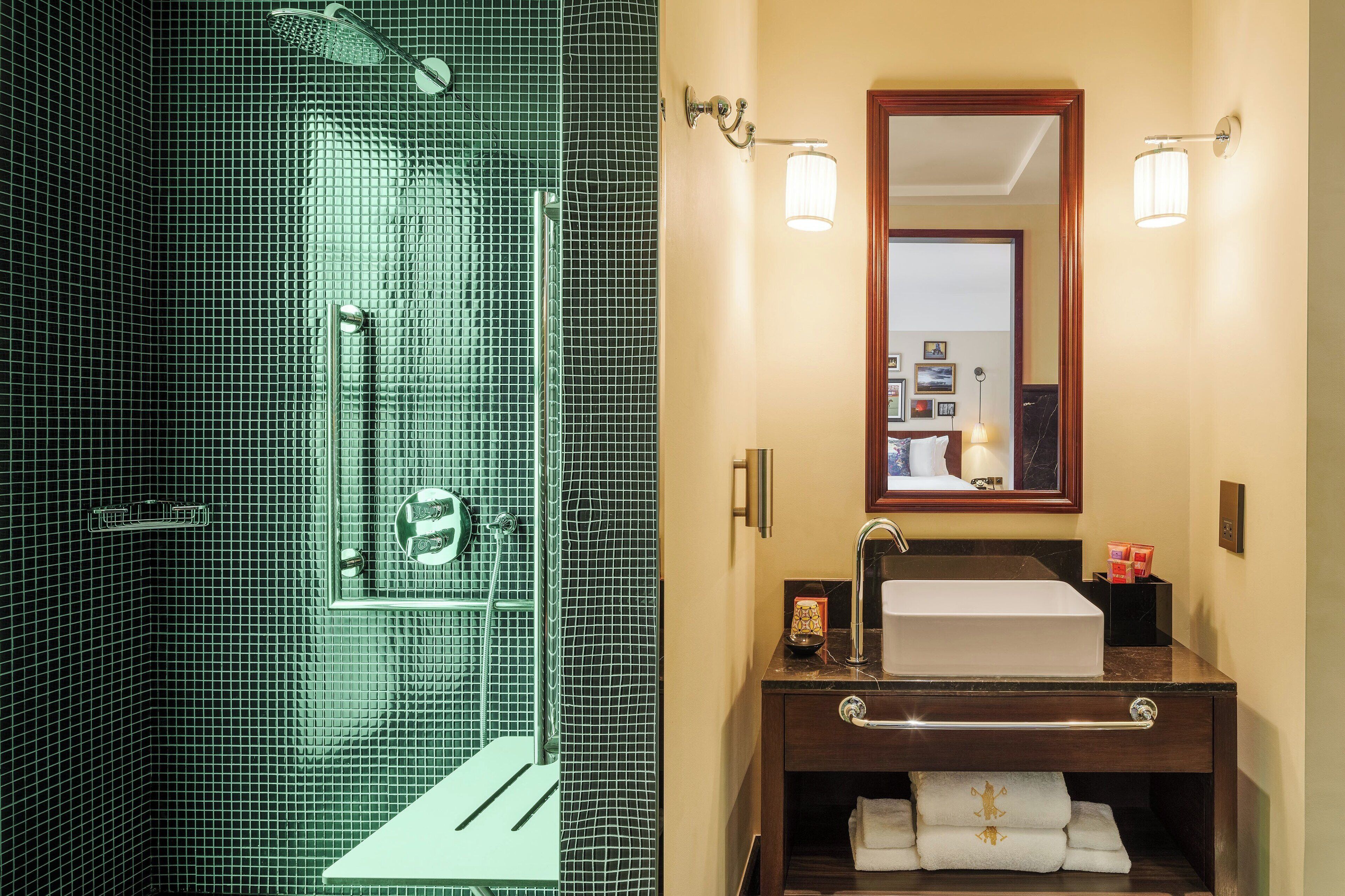 deluxe room, 1 king bed | bathroom | designer toiletries, hair dryer, bathrobes, slippers