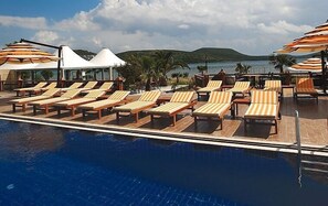 Outdoor pool, pool umbrellas, pool loungers
