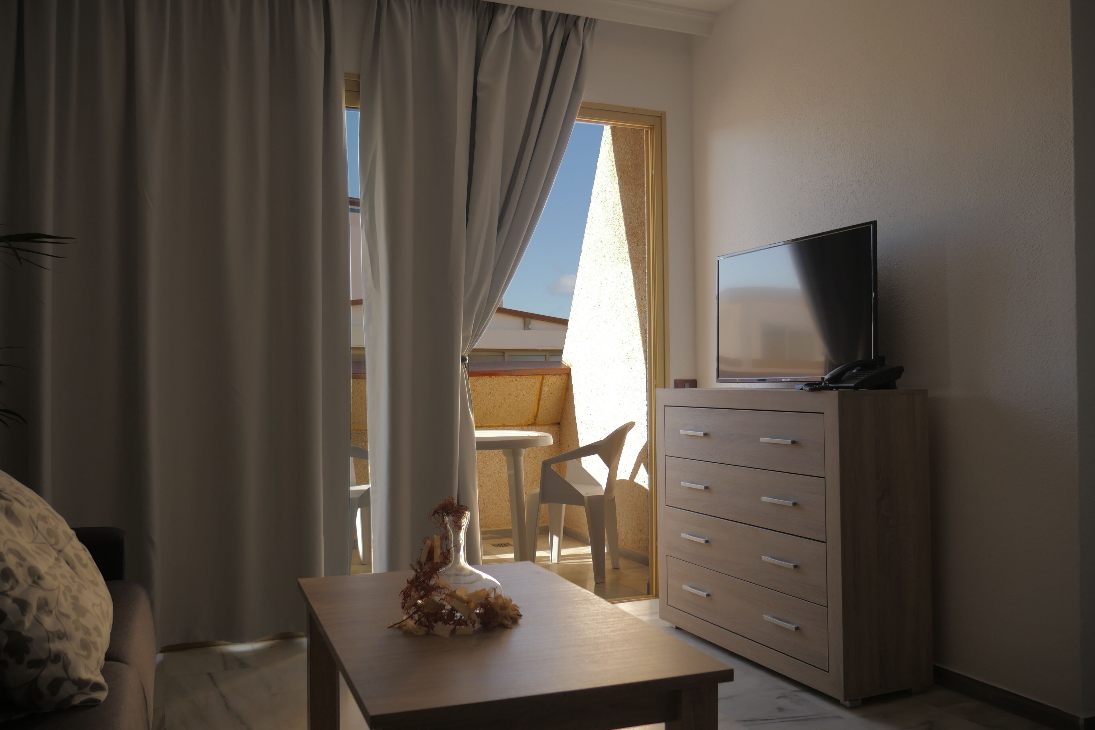 Apartment, 1 Bedroom, Balcony | Down comforters, desk, iron/ironing board, free cribs/infant beds