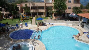 Outdoor pool, pool umbrellas, sun loungers