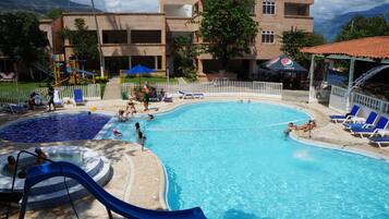 Outdoor pool, pool umbrellas, sun loungers